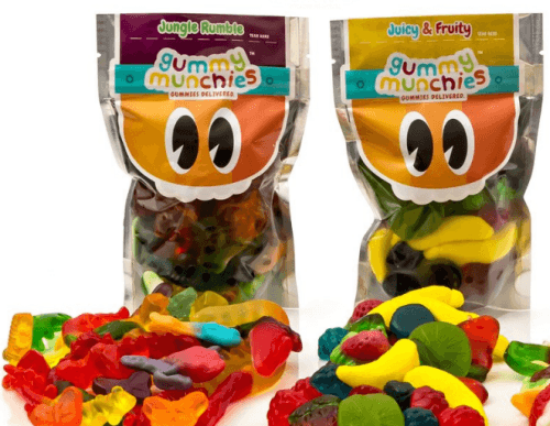 Two bags of gummies and various loose sweets