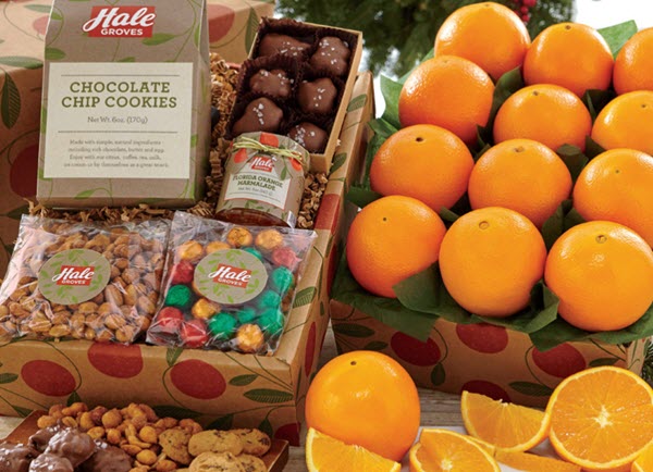 Box of fruit with various snacks