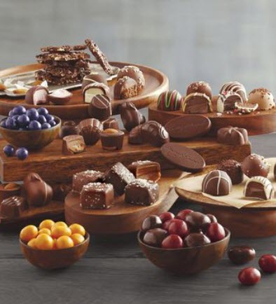 Selection of chocolates in bowls and on trays