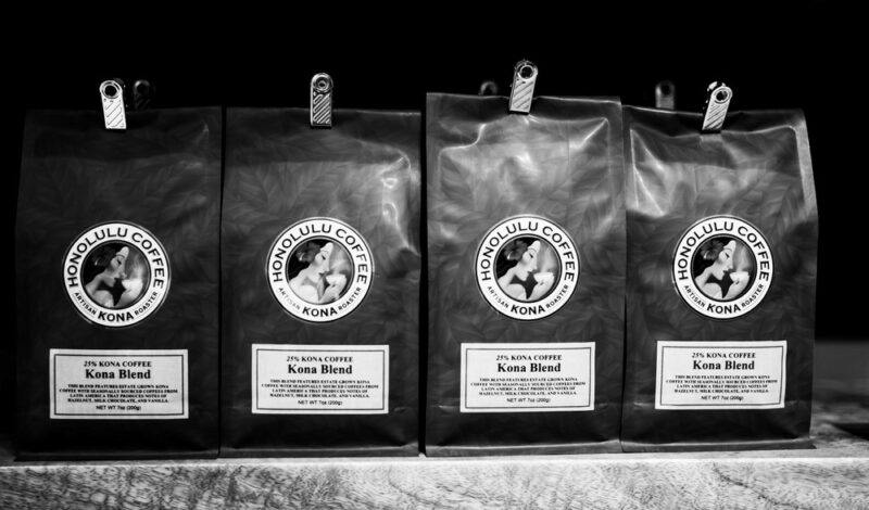 Various black bags of Hawaiian kona coffee