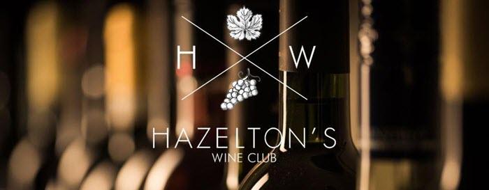 Bottles of wine with the logo and title for Hazelton's Wine of the Month Club