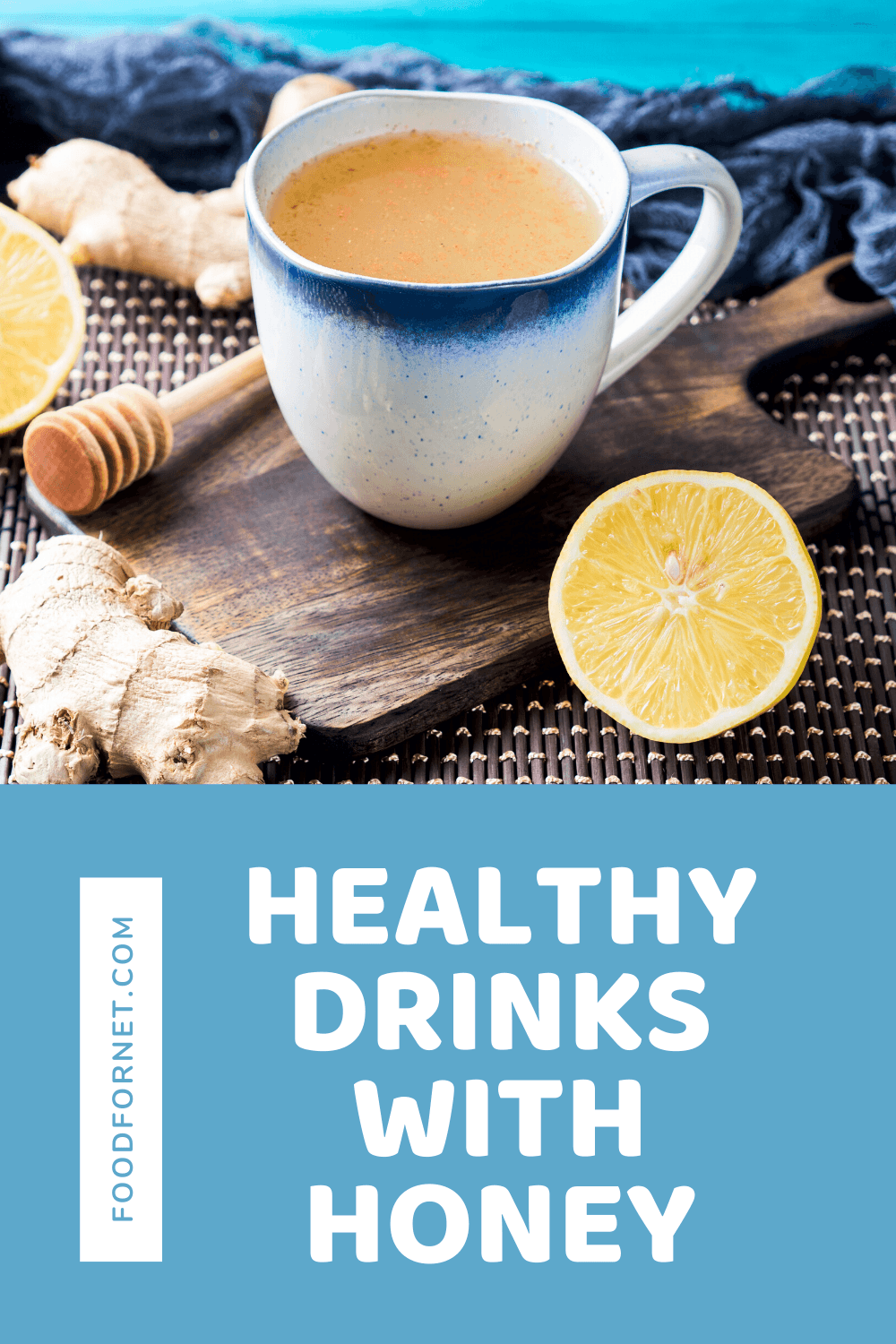 A mug containing a lemon drink on a wooden board with lemon, ginger and honey scattered around