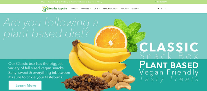 Healthy Surprise website screenshot showing cashews, bananas, saltanas, an orange and mint, near text that provides many details about the snack box and a plant-based diet. 