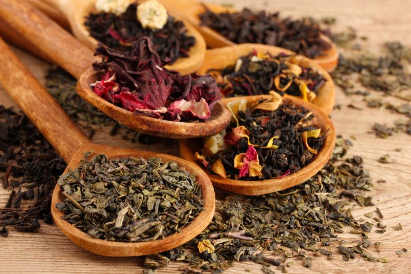 A selection of herbal teas on spoons