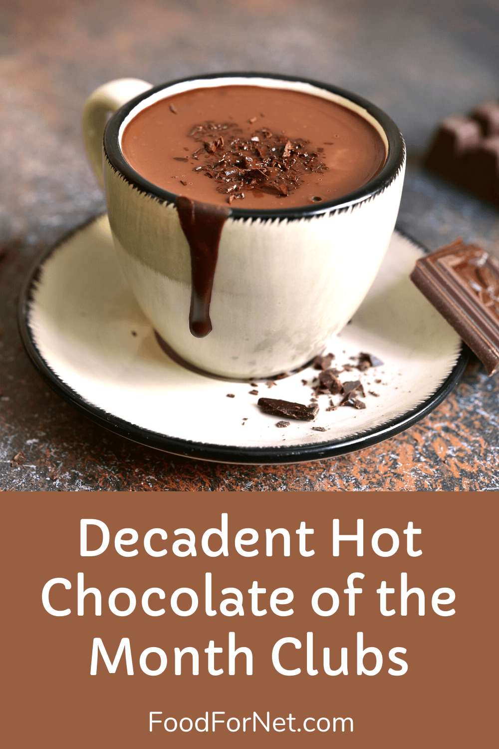 A white ceramic mug of hot chocolate on a saucer with chocolate