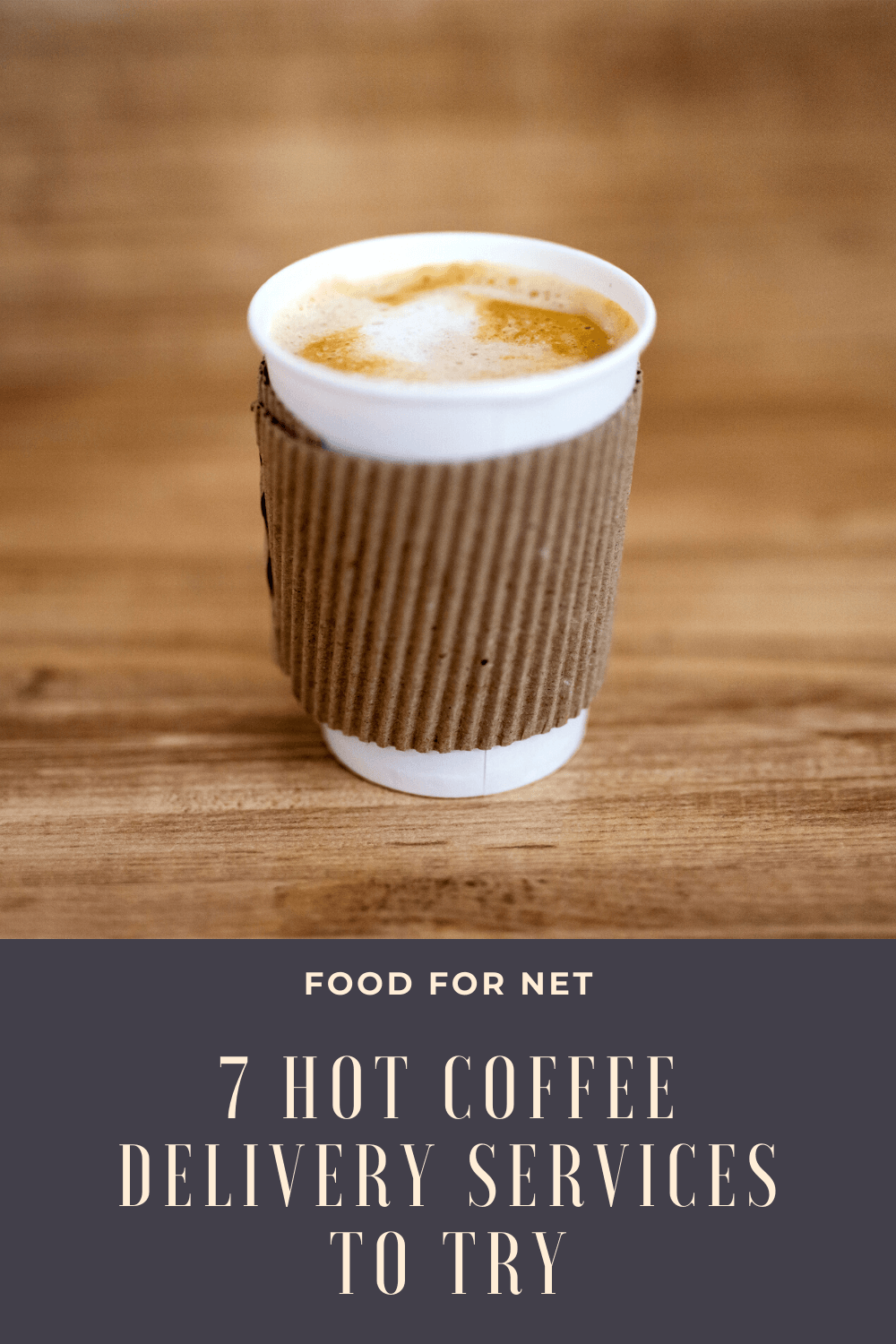 A takeaway coffee steaming with its lid off on a wooden table