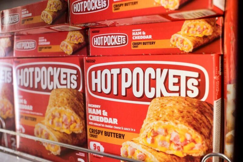 A collection of Hot Pockets in a grocery store, highlighting the idea of processed foods