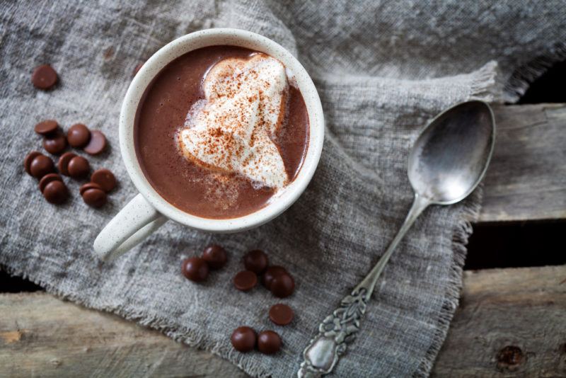 A top-down image of a hot chocolate mug on a napkin