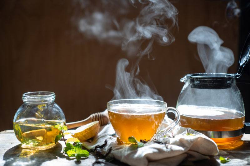 Hot tea in a mug and a tea pot