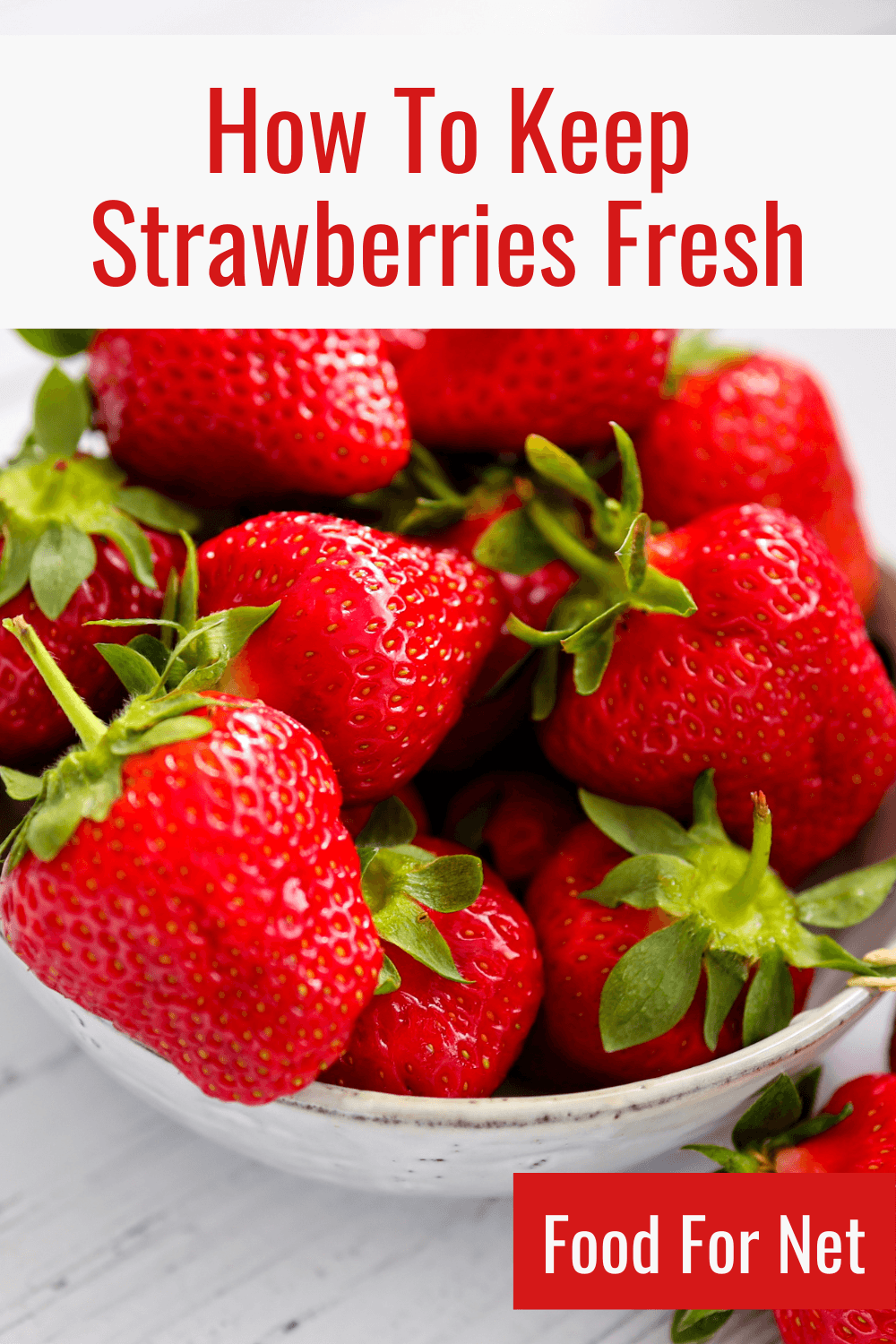 How To Keep Strawberries Fresh. A white bowl containing fresh strawberries, looking at ways to keep strawberries fresh