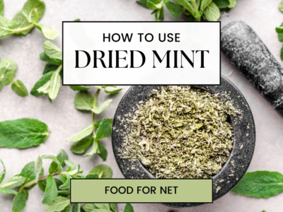 A bowl of dried mint, next to fresh mint leaves, looking at how to use dried mint