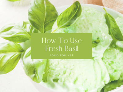 A white dish containing basil ice cream and basil leaves, as one example of how to use fresh basil