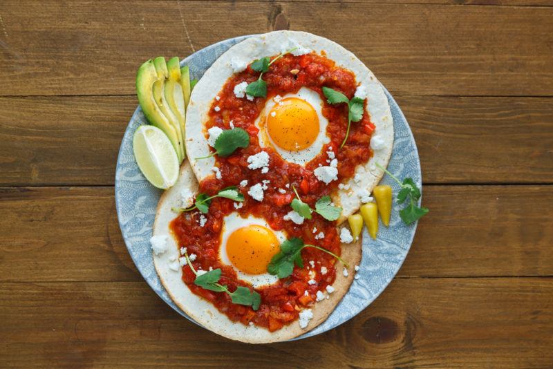 Two torillas with salsa and fried eggs