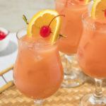 Three glasses of a hurricane cocktail with ice