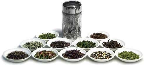 A can of tea and a selection of tea leaves