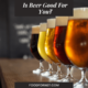 Five different types of beer on a bar, looking at whether beer is good for you