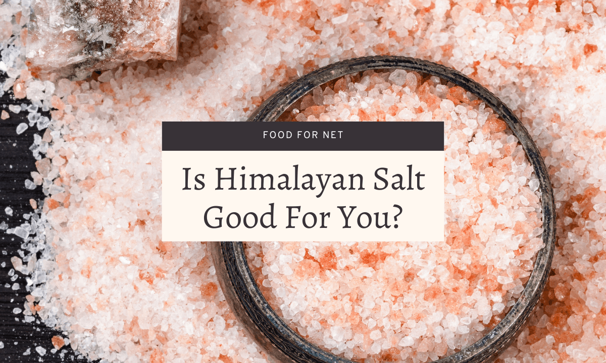 A pile of Himalayan salt on a table, with a bowl of the salt in the middle