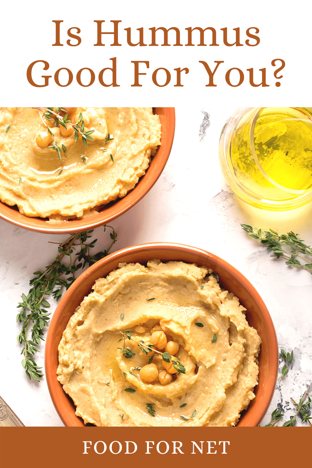 Two orange bowls filled with hummus, looking at whether hummus is good for you