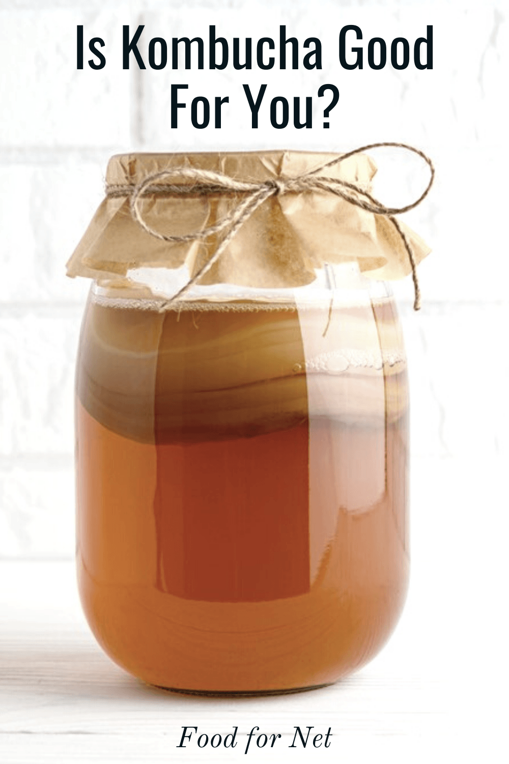 Is Kombucha Good For You? A large jar of kombucha fermenting with the SCOBY