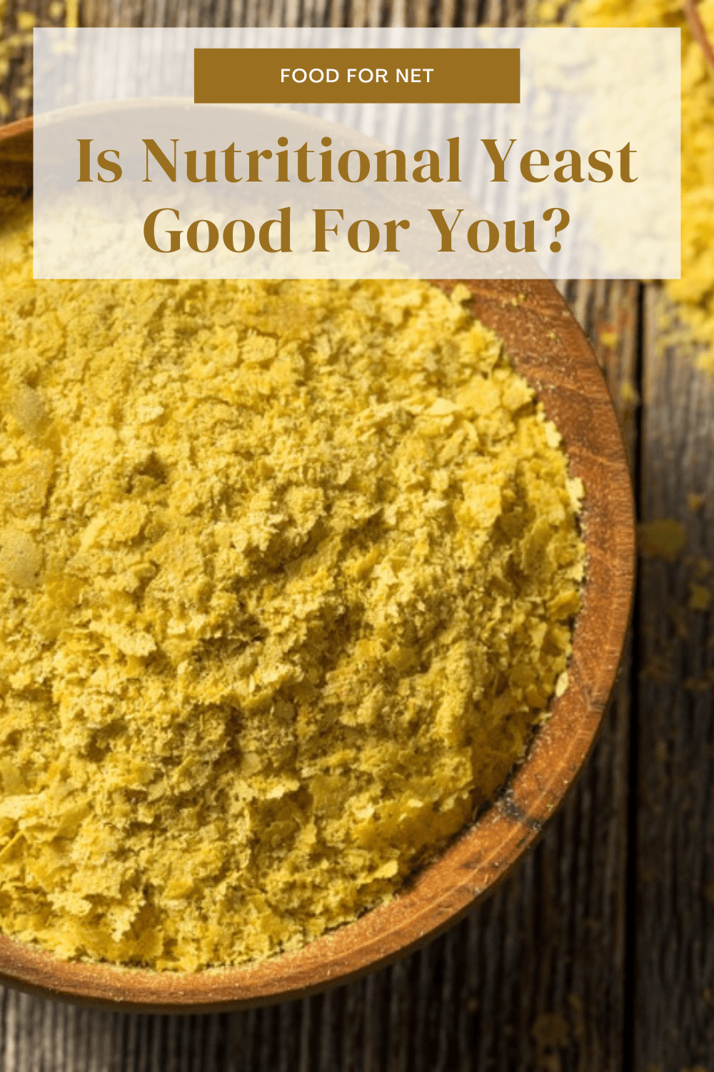 Is Nutritional Yeast Good For You? A large brown bowl of nutritional yeast on a wooden table