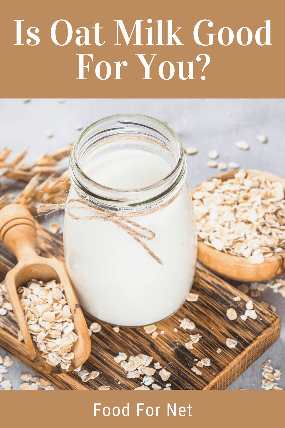 Is Oat Milk Good For You? A jar of oat milk on a wooden board next to a scoop of oats and a small bowl of oats