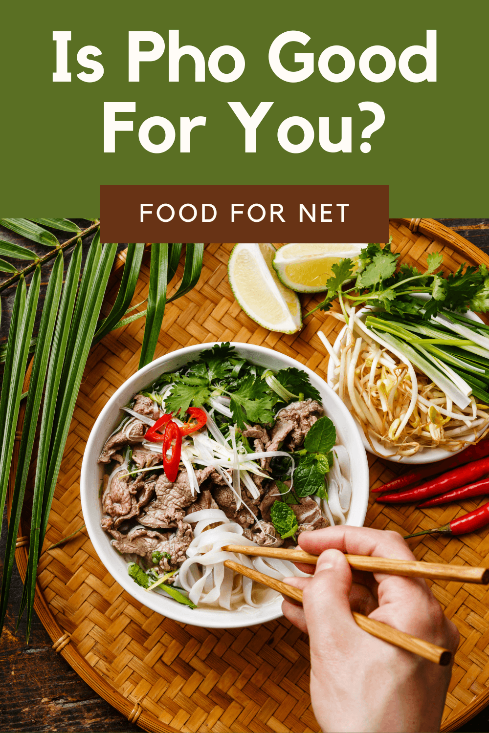 A top down shot of a dinner table, with a bowl of pho that someone is eating with chopsticks, looking at whether pho is good for you