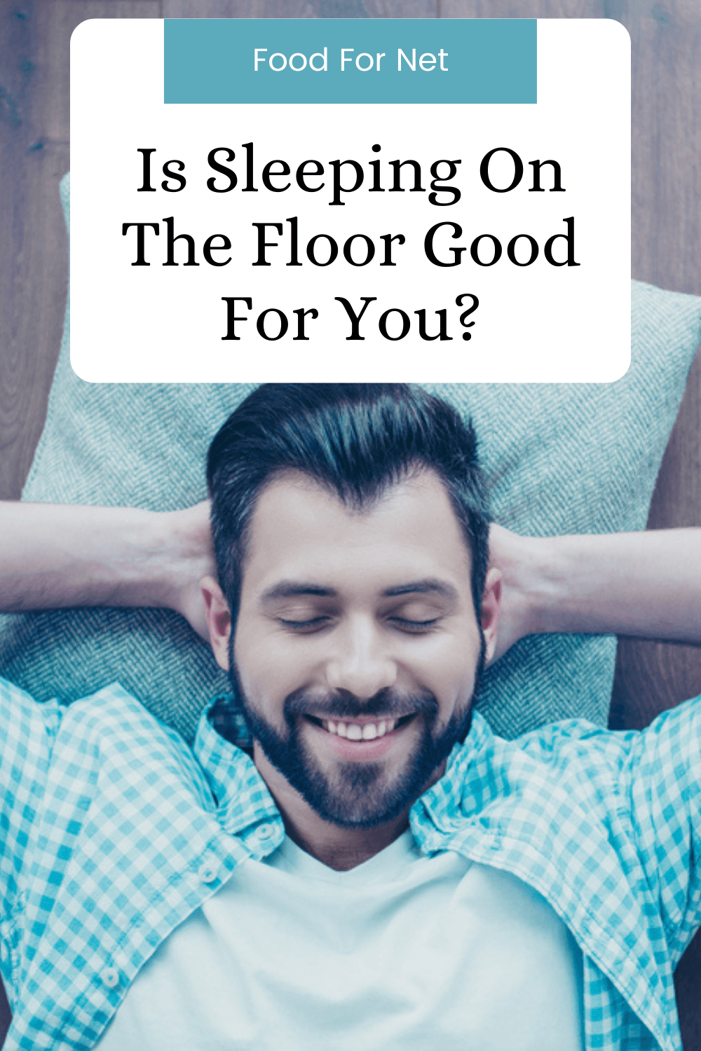 A happy man lying on the floor, with his hands behind his head, highlighting whether sleeping on the floor is good for you