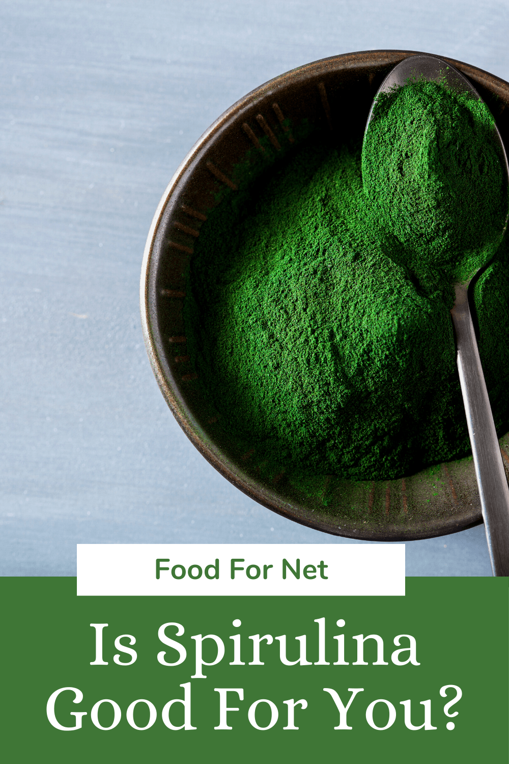 A bowl of spirulina powder with a spoon