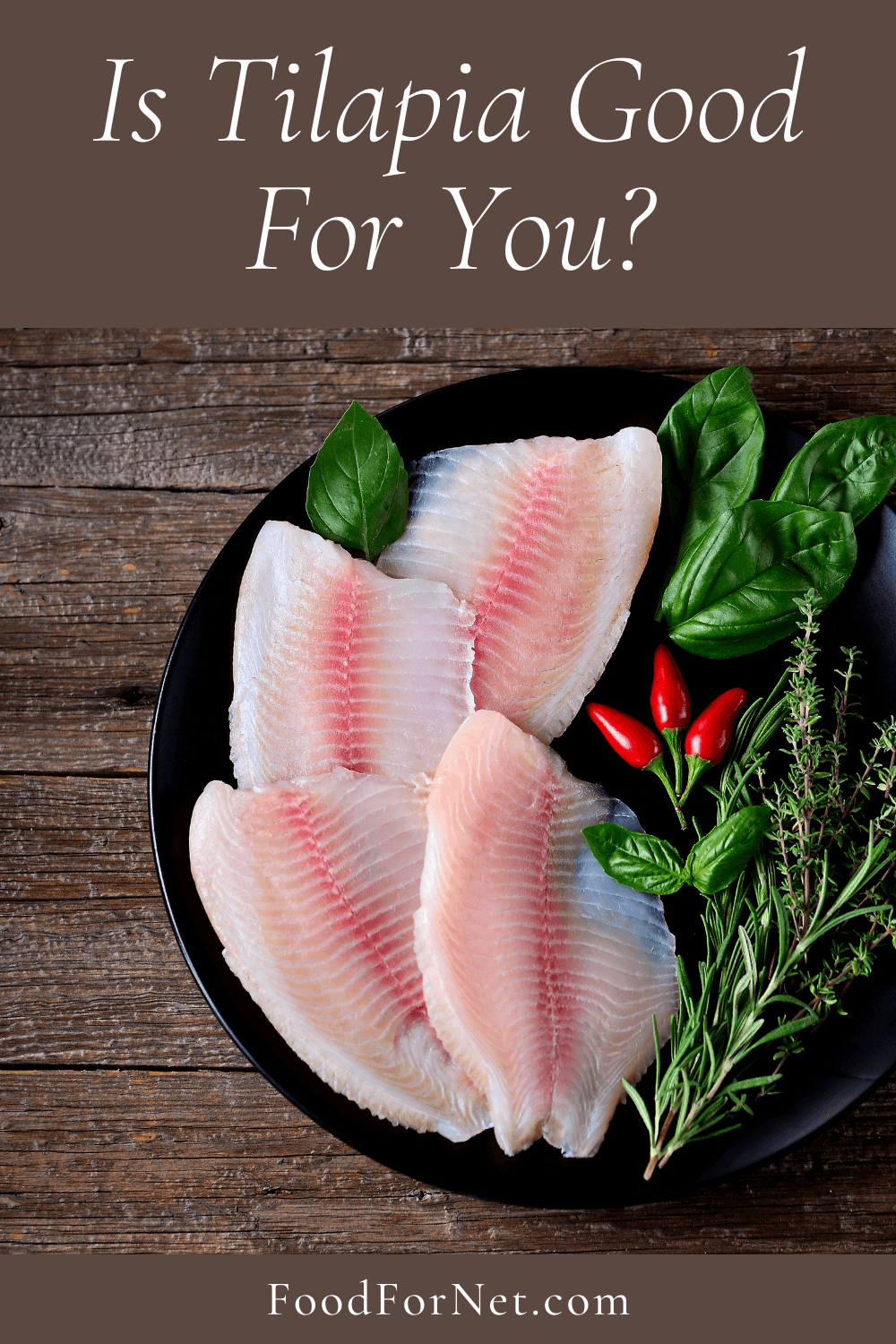 Is Tilapia Good For You? A black plate with greens and tilapia fillets, highlighting the question of whether tilapia is good for you