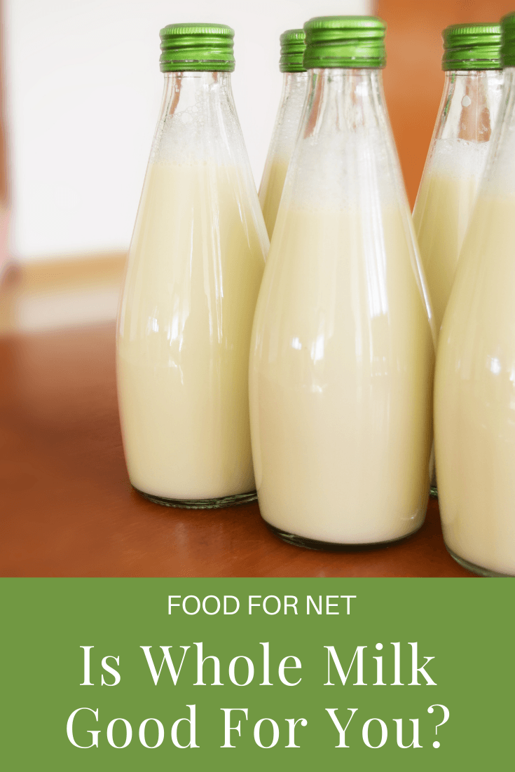 Bottles of whole milk with green lids, looking at whether whole milk is good for you