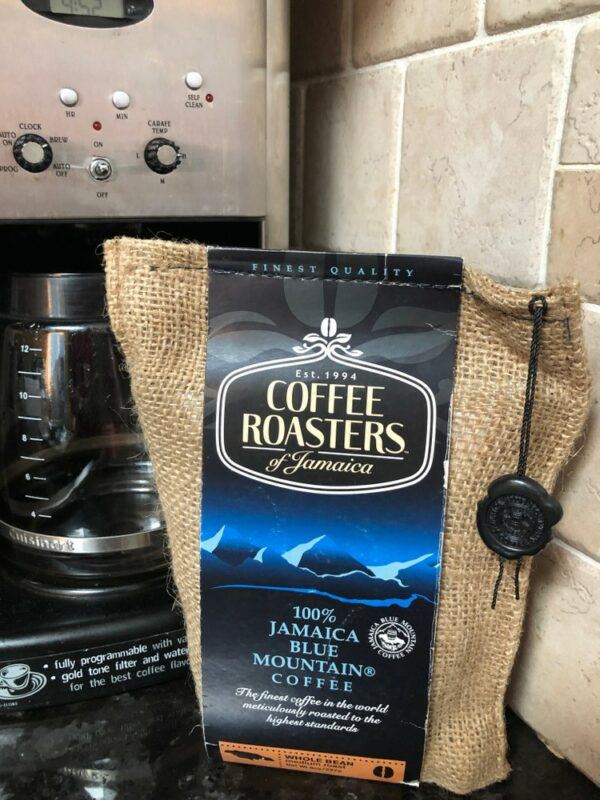 A bag of Jamaican Blue Mountain coffee, in front of a coffee machine