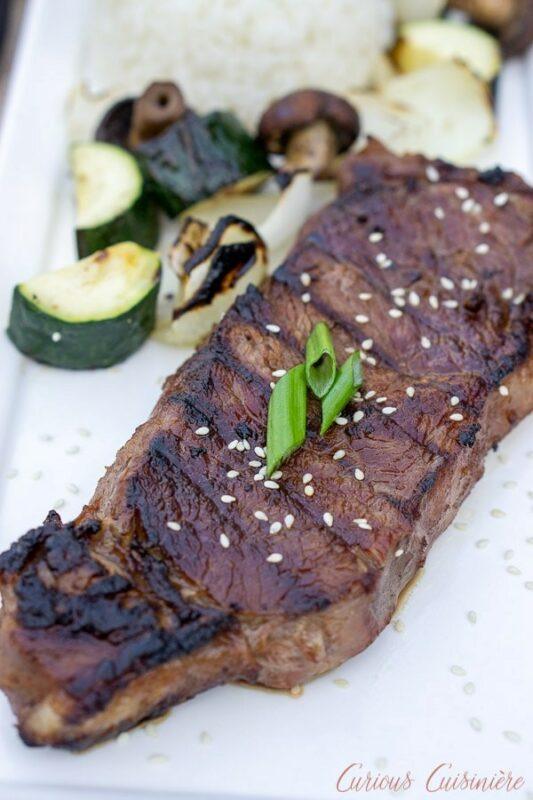 A white table with a large piece of grilled Japanese hibachi steak