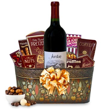 Jordan Cabernet Sauvignon Gift Basket | Food For Net A colored basket with red snacks and red wine.