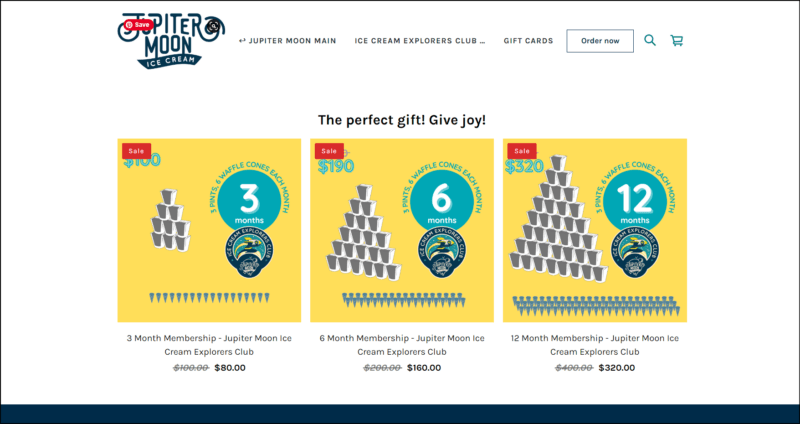 screenshot of Jupiter Moon Ice Cream's Ice Cream Explorers Club's web page, dominantly white with the website's logo on top alongside the main navigation menu, the main content area shows three yellow graphics with pints and number designs, one for reach subscription plan