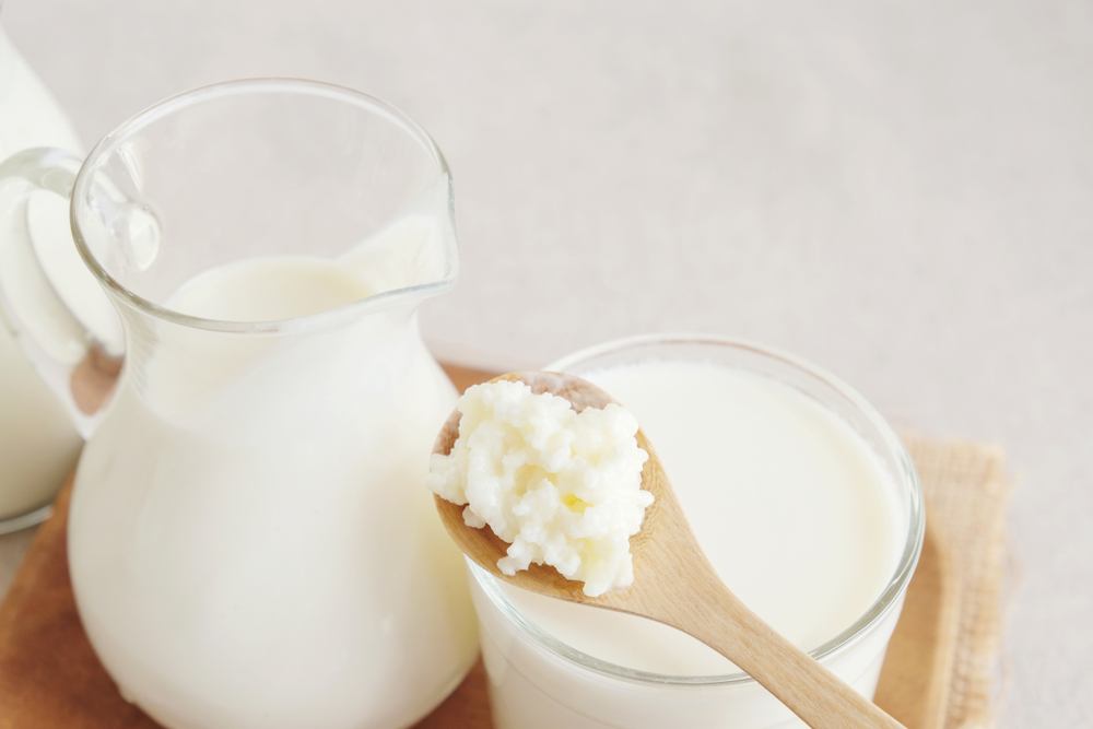 A glass and a jug of kefir