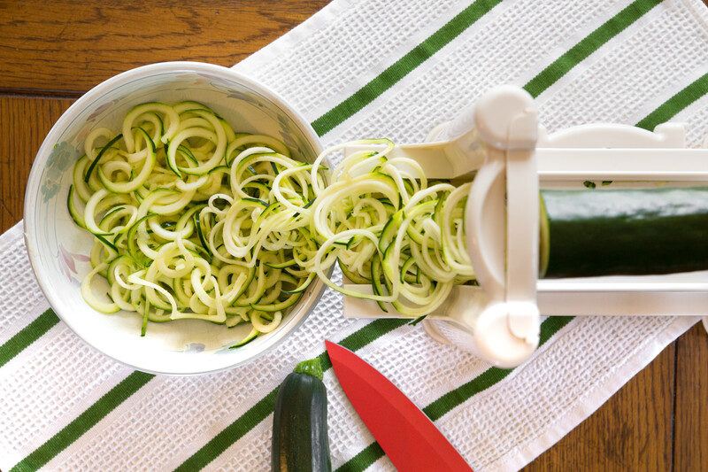 Keto Zoodle Recipes | Food For Net zuccshini being shredded into "noodle" shapes and falling into a bowl