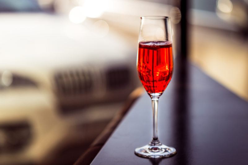 A Kir cocktail on a bar