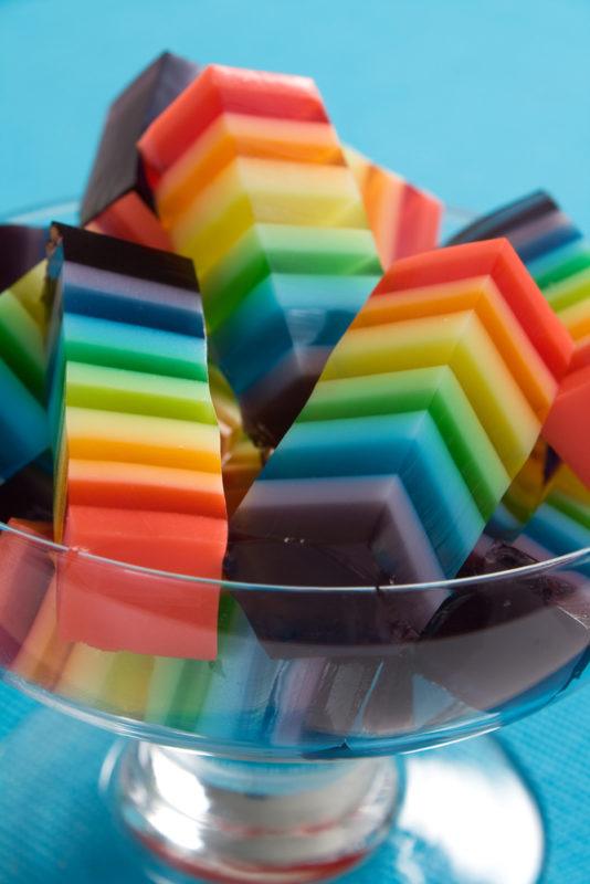 A glass bowl with stacks of layered jello