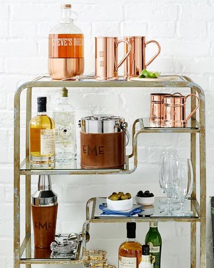 Leather Wrapped Ice Bucket With Tongs | Food For Net A set of shelves with various bar tools