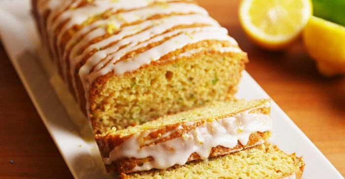 A sliced loaf of lemon bread with icing