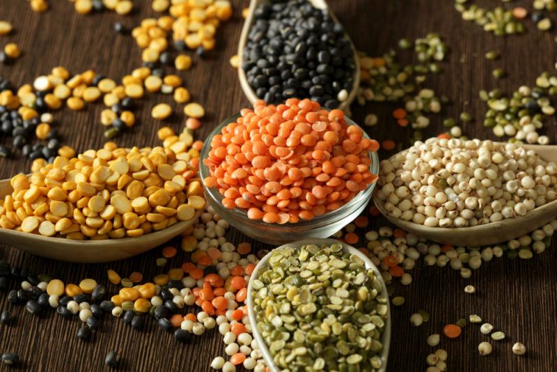 Spoons or small bowls contaiing different colors of lentils