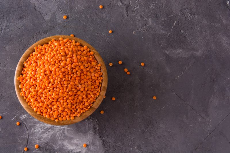 A top-down image of a bowl of red lentils