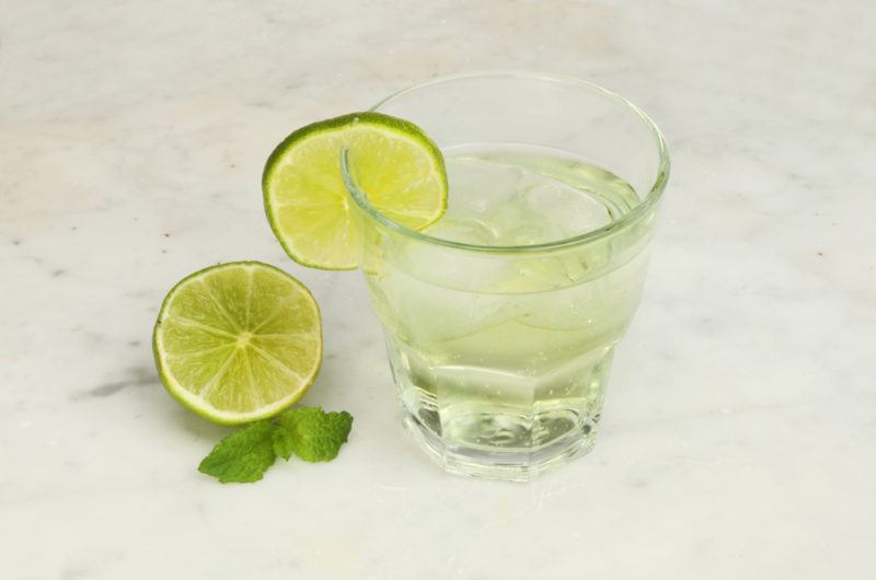 A glass of diluted lime cordial