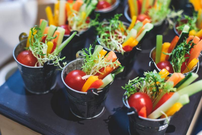 Little pails filled with vegetables and dips