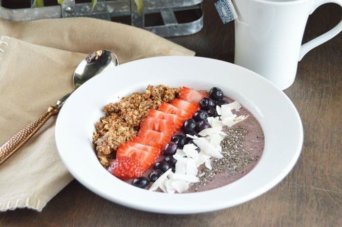 Low Carb Açaí Berry Bowl | Food For Net An acai smoothie in a white bowl with a variety of keto toppings