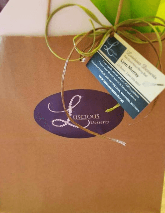 Luscious Desserts Cupcake Club | Food For Net A paper bag containing cupcakes