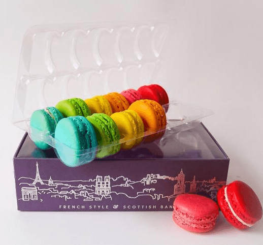 A purple box with various colored macarons