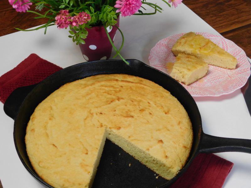 Mama’s Sweet Keto Cornbread | Food For Net Cornbread in a pan with a large slice removed