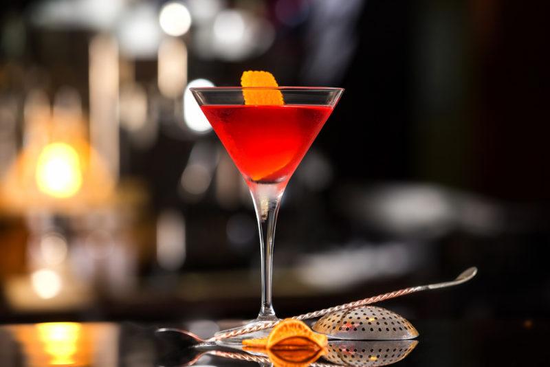 A Manhattan in a cocktail glass on a bar