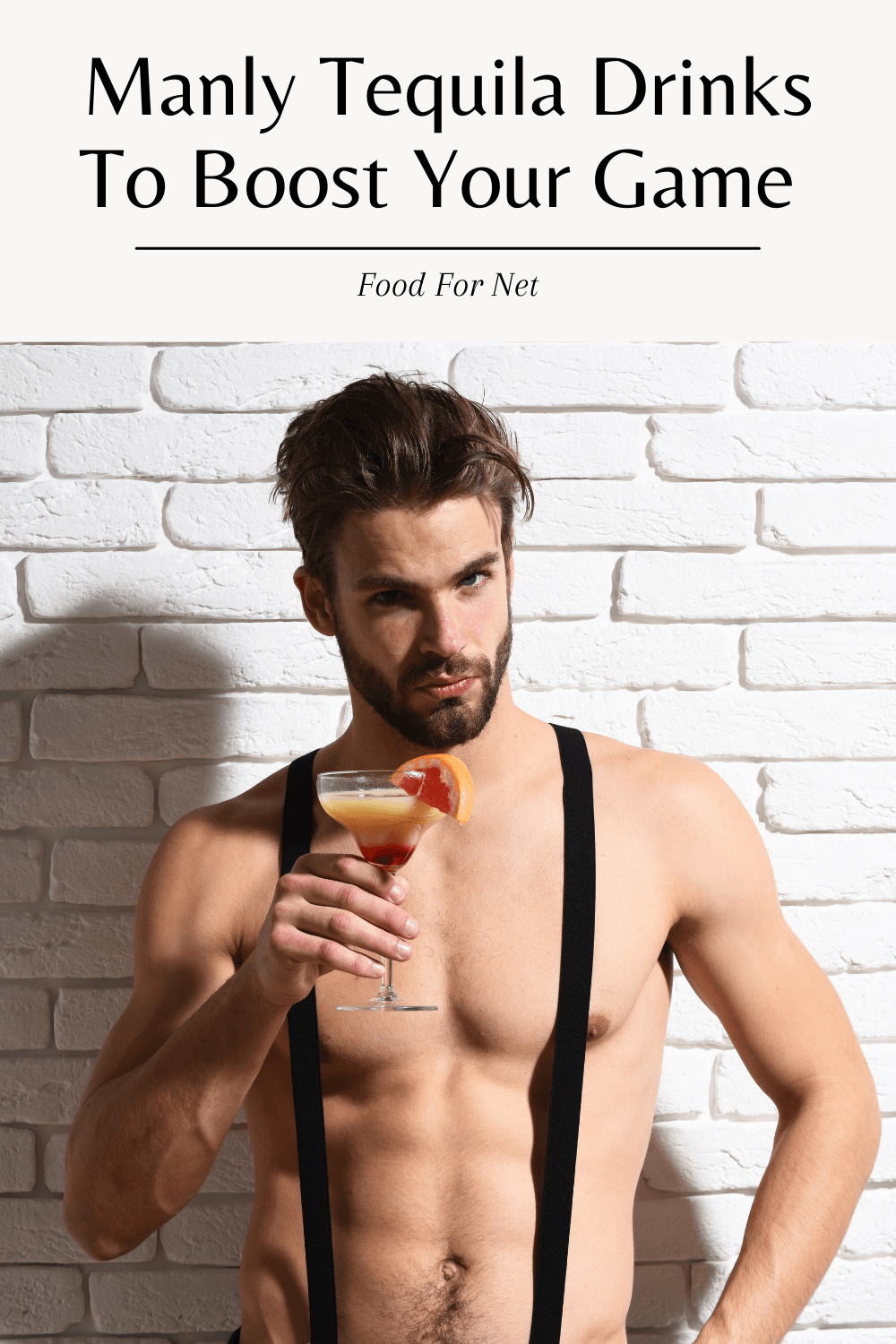 A handsome young man in suspenders and no shirt, holding a cocktail, highlighting the idea of manly tequila drinks